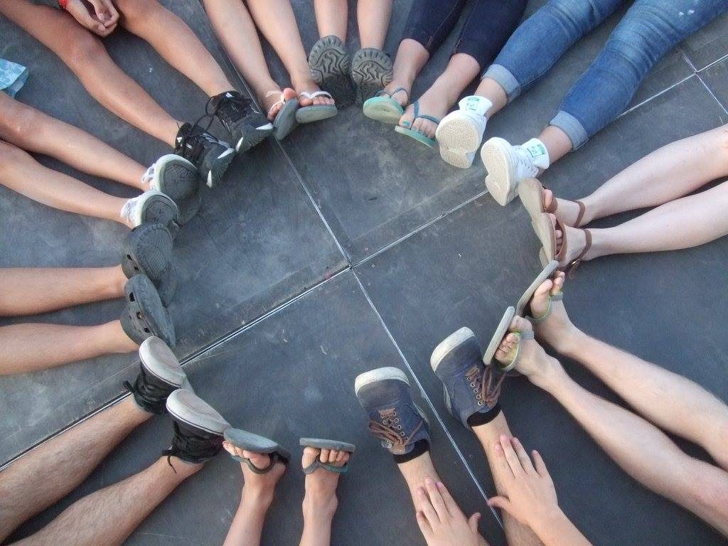 Youth legs and feet in a circle